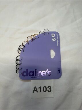 Claire's Purple Earring Display Card with Mixed Metal Rings